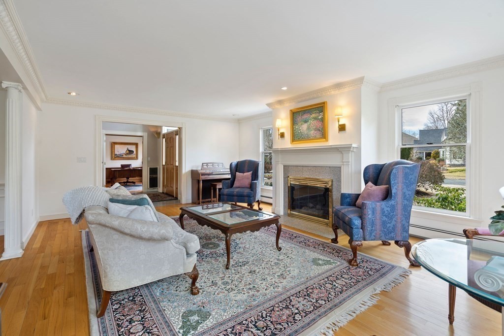 23 Louis Drive Wellesley, MA 02481 - Photo 14 of 42 a living room with furniture and a fireplace