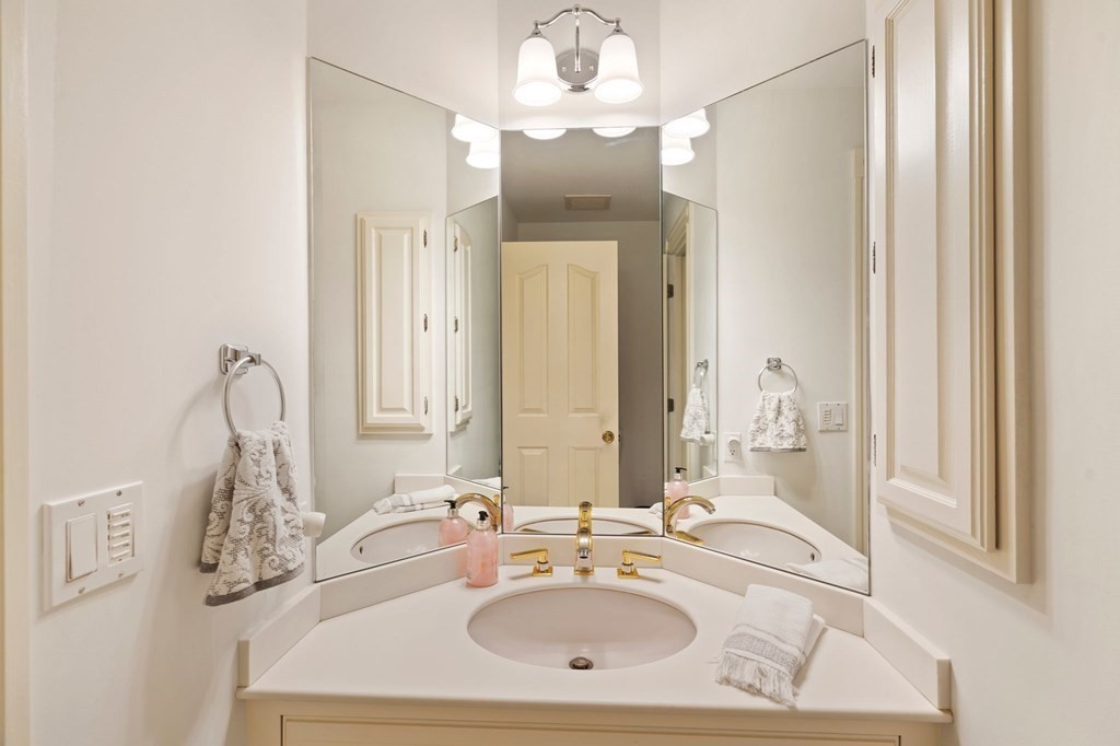23 Louis Drive Wellesley, MA 02481 - Photo 18 of 42 a bathroom with a sink vanity and a mirror