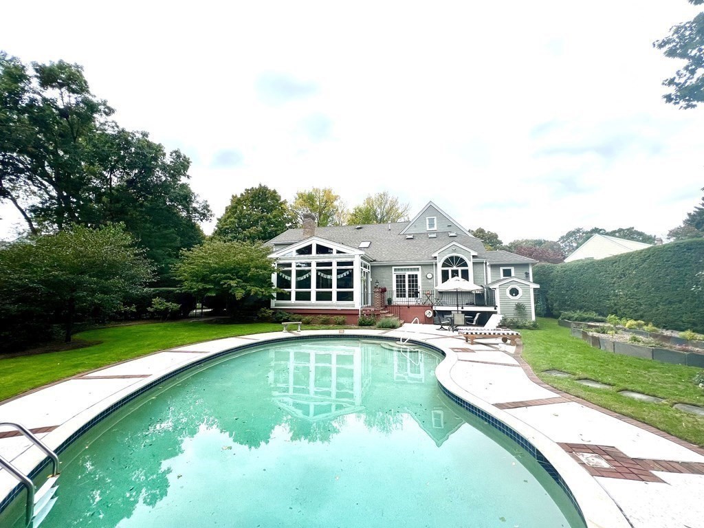 23 Louis Drive Wellesley, MA 02481 - Photo 2 of 42 an aerial view of a house with swimming pool having outdoor seating