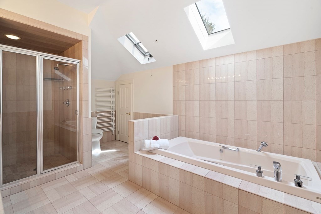 23 Louis Drive Wellesley, MA 02481 - Photo 25 of 42 a bathroom with a bathtub and a shower