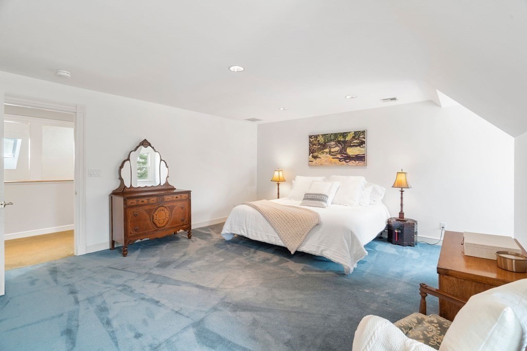 23 Louis Drive Wellesley, MA 02481 - Photo 26 of 42 a spacious bedroom with a bed and a couch