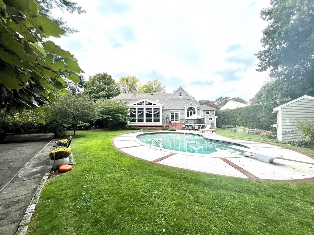 23 Louis Drive Wellesley, MA 02481 - Photo 34 of 42 a view of a house with swimming pool and a yard