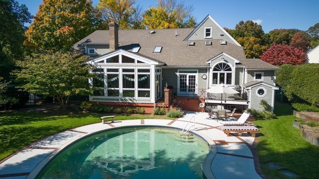 23 Louis Drive Wellesley, MA 02481 - Photo 35 of 42 a swimming pool with outdoor seating and yard