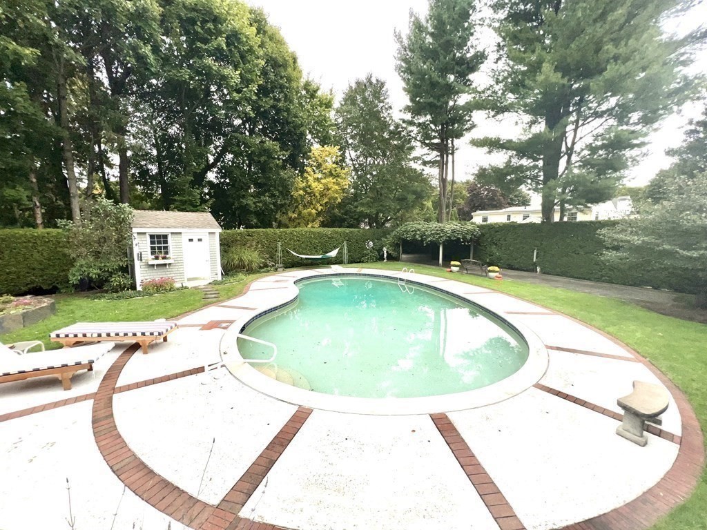 23 Louis Drive Wellesley, MA 02481 - Photo 36 of 42 a view of a swimming pool with a yard