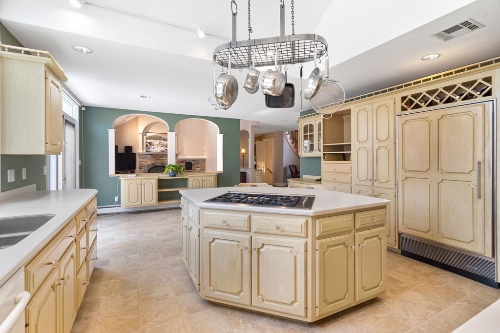 23 Louis Drive Wellesley, MA 02481 - Photo 7 of 42 a kitchen with stainless steel appliances granite countertop a stove and cabinets