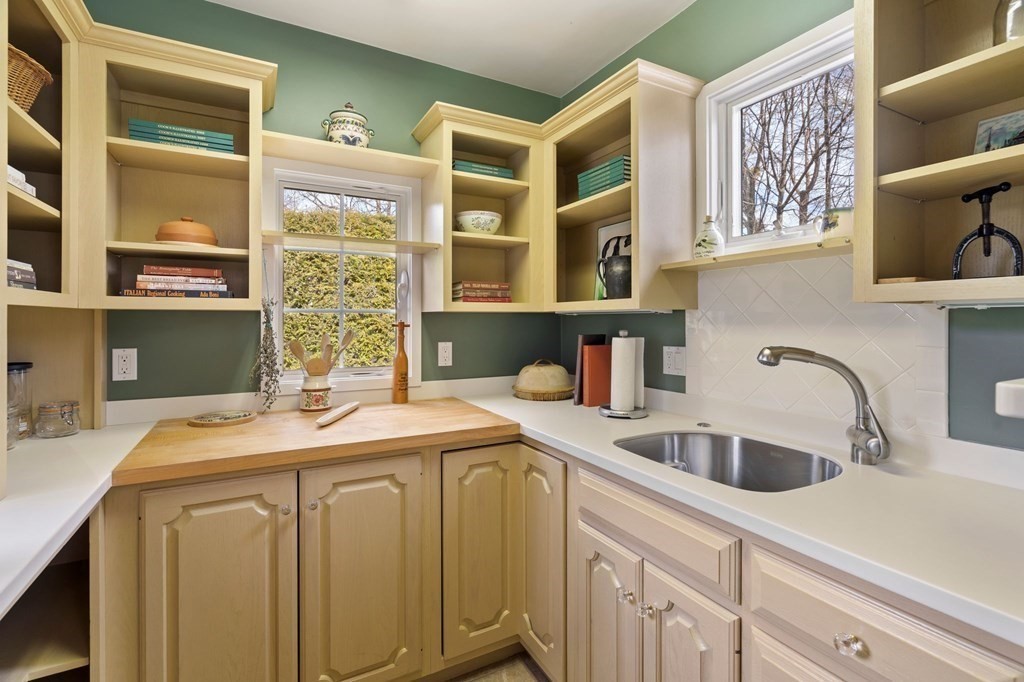 23 Louis Drive Wellesley, MA 02481 - Photo 9 of 42 a kitchen with a sink and a window
