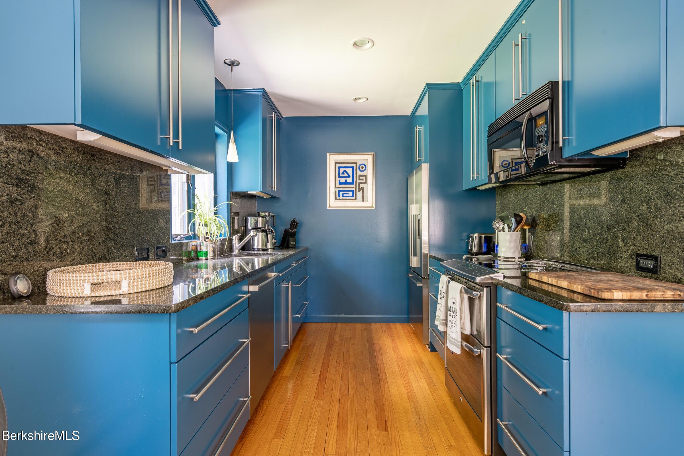 91 Brush Hill Road Great Barrington, MA 01230 - Photo 15 of 40 a kitchen with stainless steel appliances granite countertop a sink stove and refrigerator