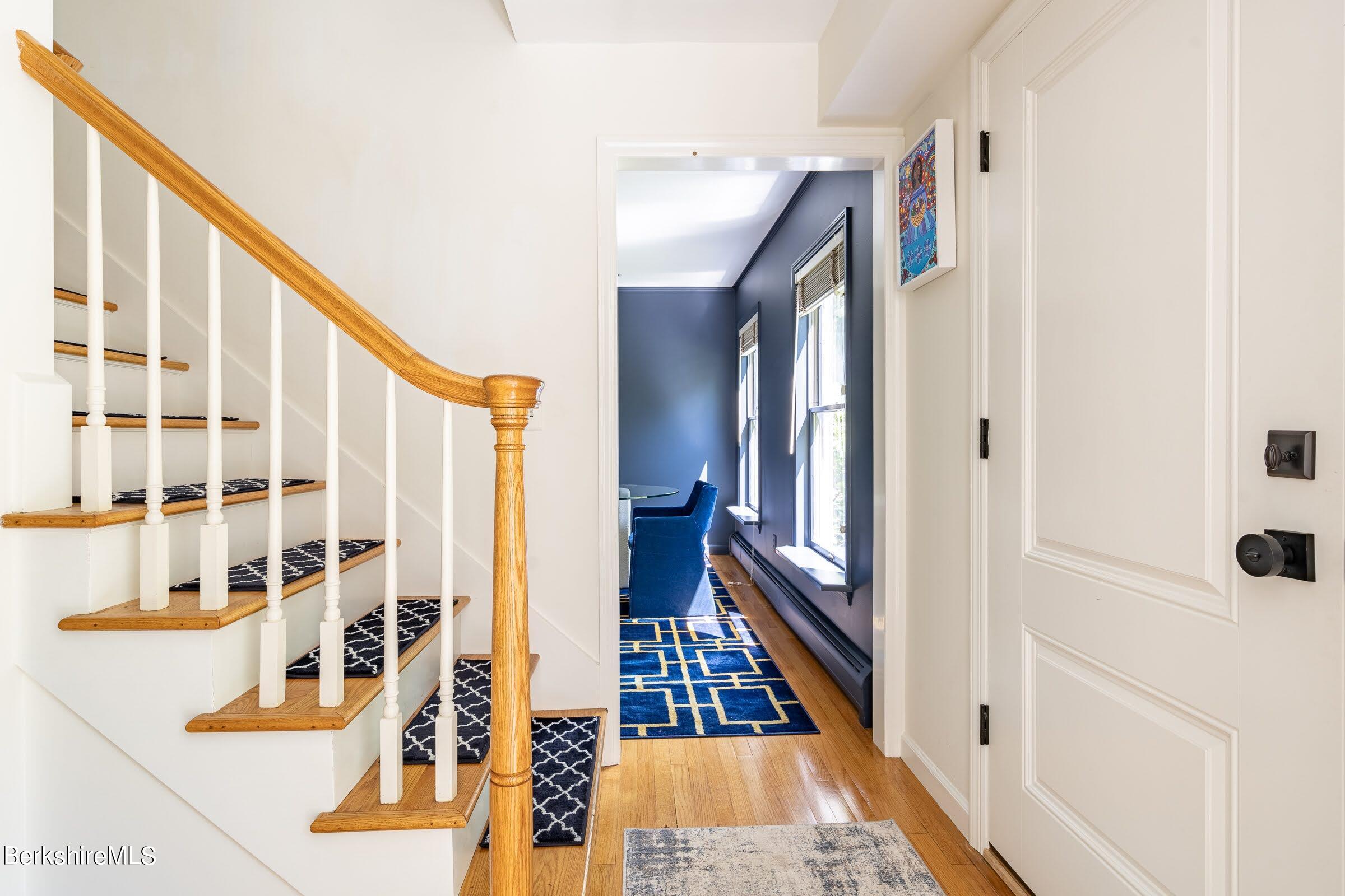 91 Brush Hill Road Great Barrington, MA 01230 - Photo 19 of 40 a view of a hallway with wooden floor and staircase