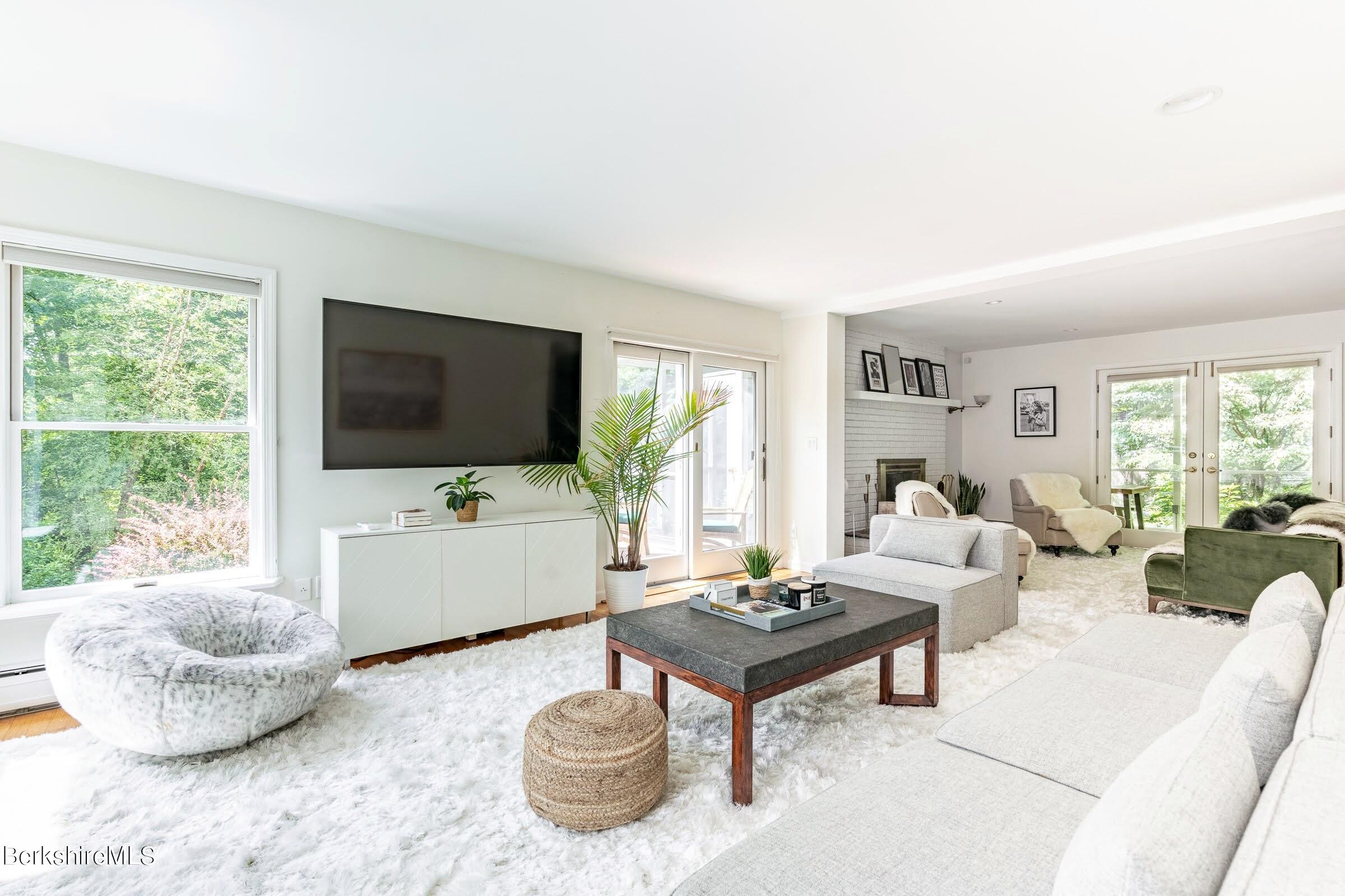 91 Brush Hill Road Great Barrington, MA 01230 - Photo 3 of 40 a living room with furniture and a flat screen tv
