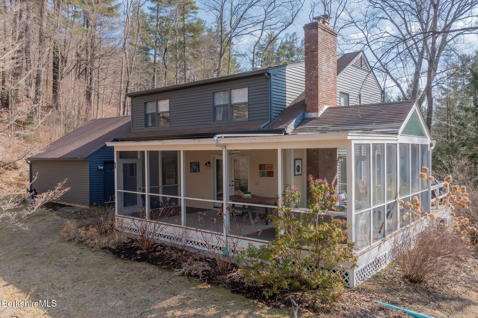 91 Brush Hill Road Great Barrington, MA 01230 - Photo 36 of 40 a front view of a house with plants