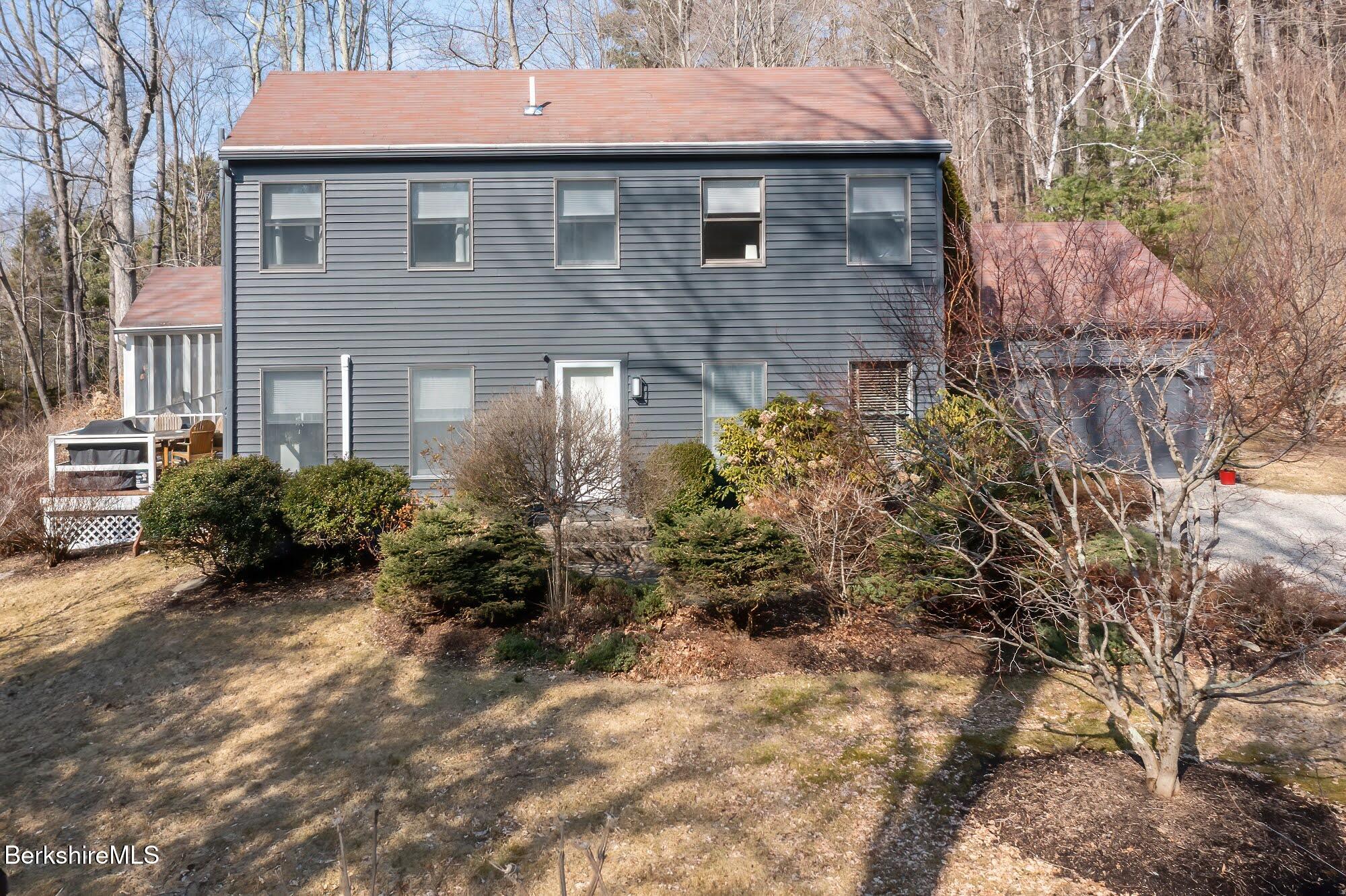 91 Brush Hill Road Great Barrington, MA 01230 - Photo 37 of 40 a front view of a house with garden