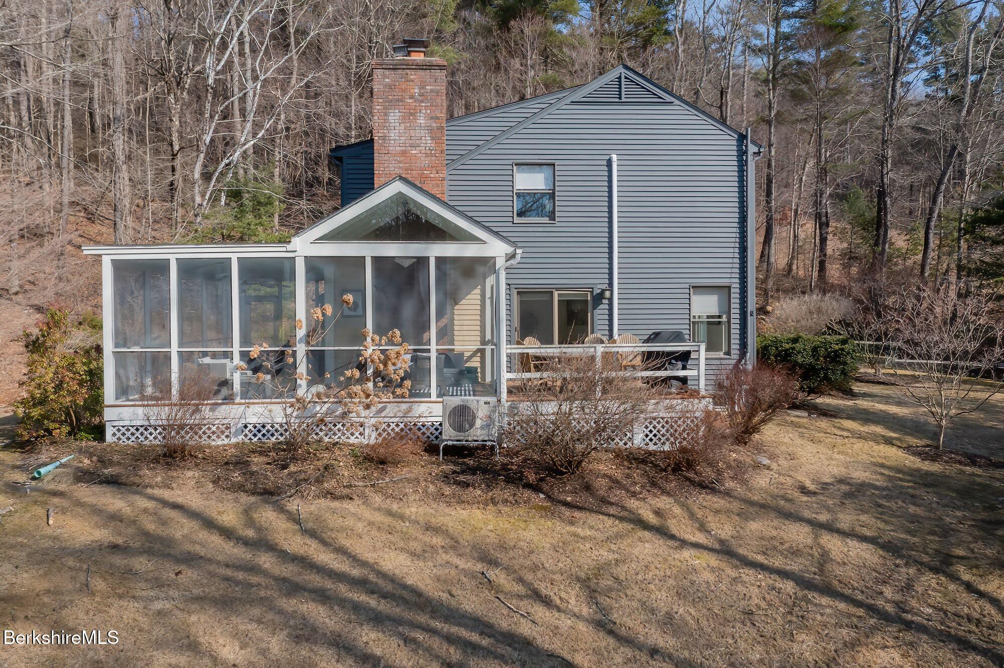 91 Brush Hill Road Great Barrington, MA 01230 - Photo 39 of 40 a front view of a house with garden