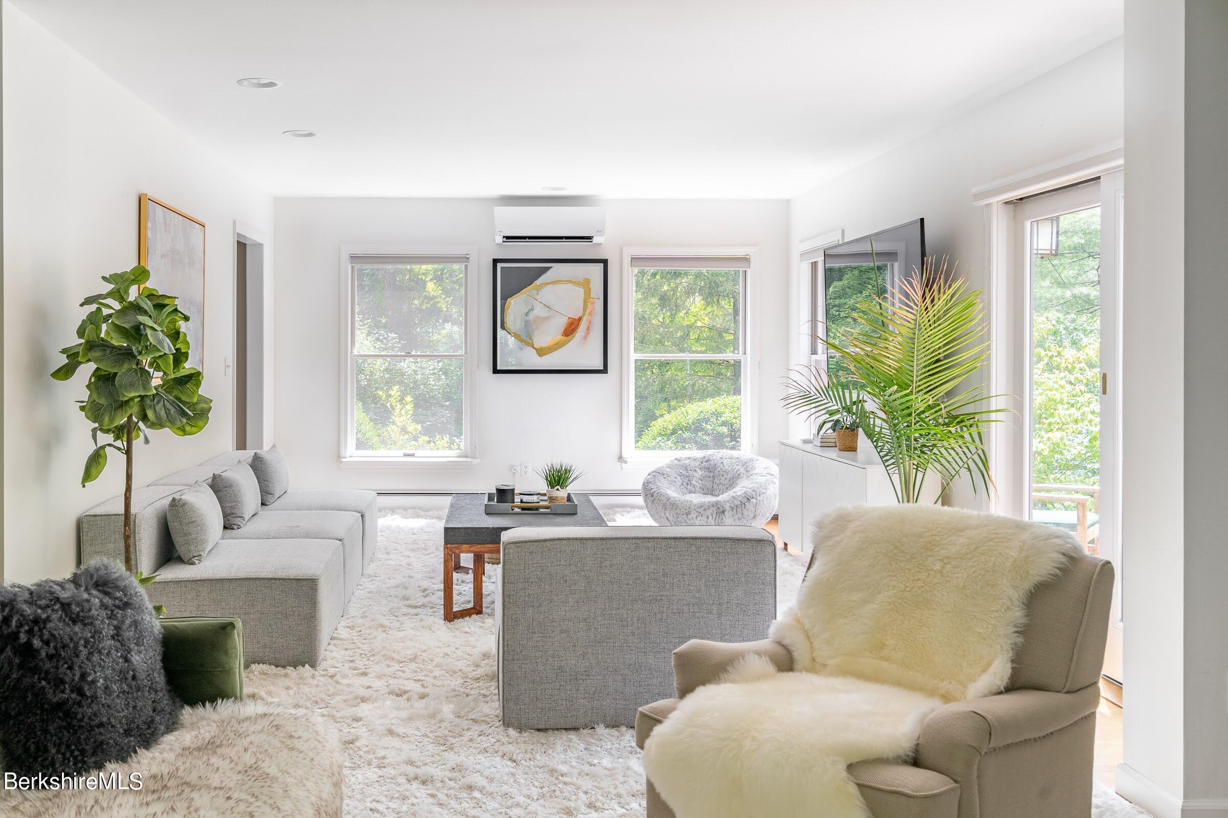 91 Brush Hill Road Great Barrington, MA 01230 - Photo 6 of 40 a living room with furniture and a large window