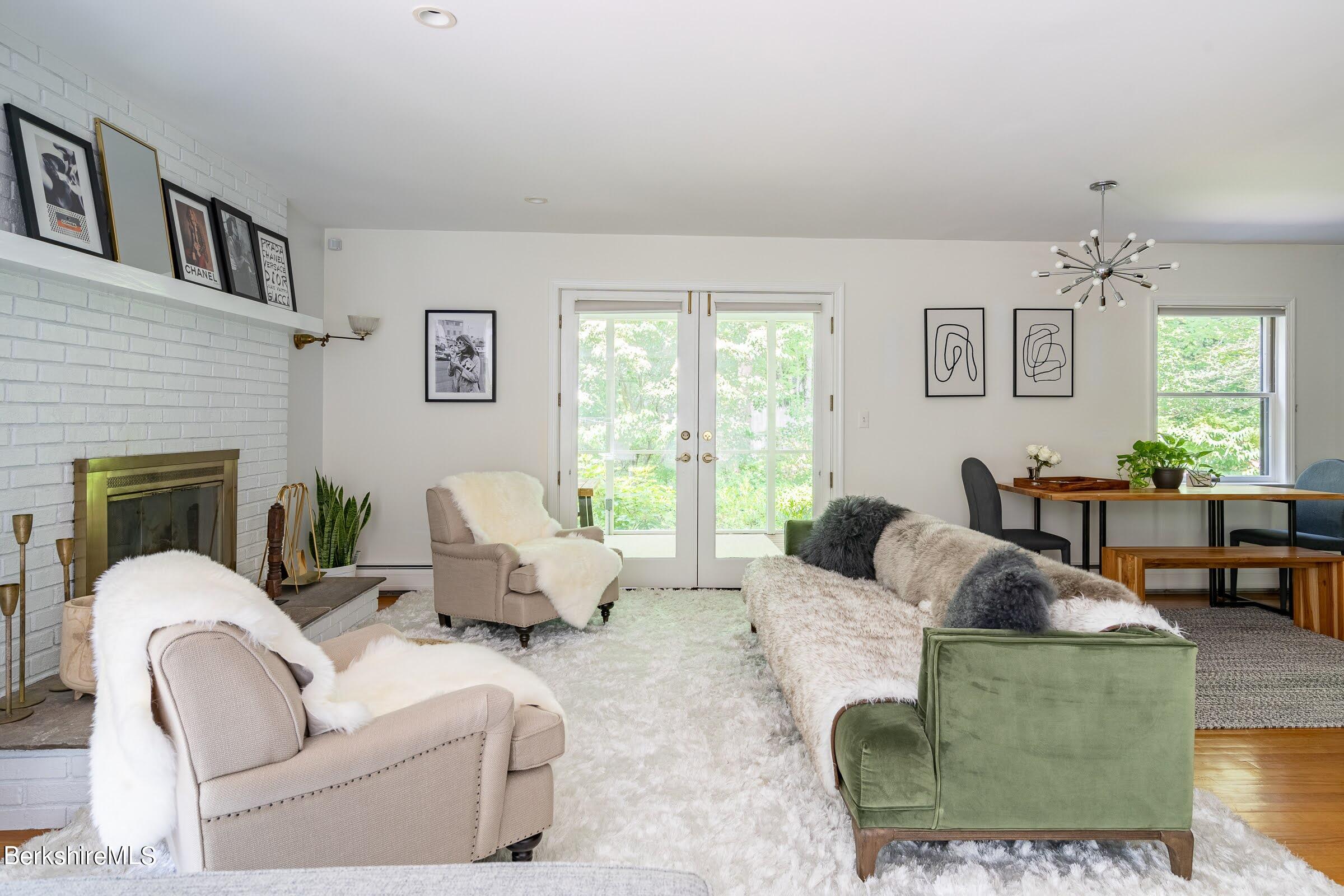 91 Brush Hill Road Great Barrington, MA 01230 - Photo 8 of 40 a living room with furniture and a large window
