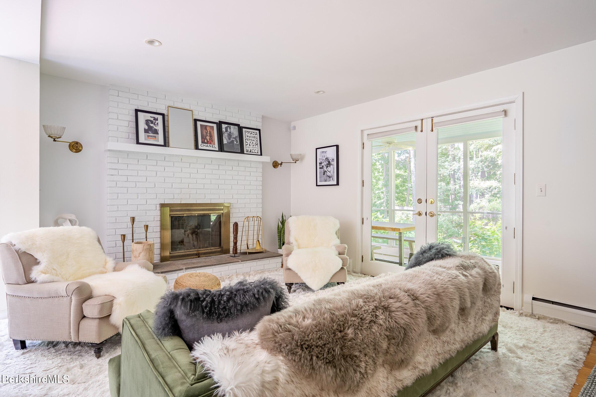 91 Brush Hill Road Great Barrington, MA 01230 - Photo 9 of 40 a living room with furniture and a fireplace