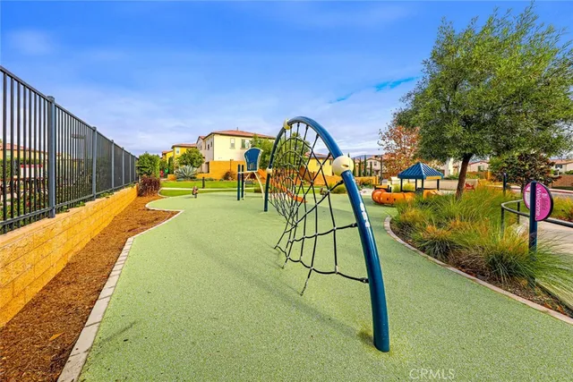 a view of swimming pool with a patio and a fountain