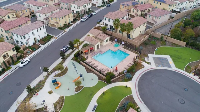 an aerial view of a house with a swimming pool