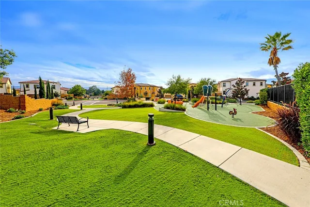 a view of a park with houses