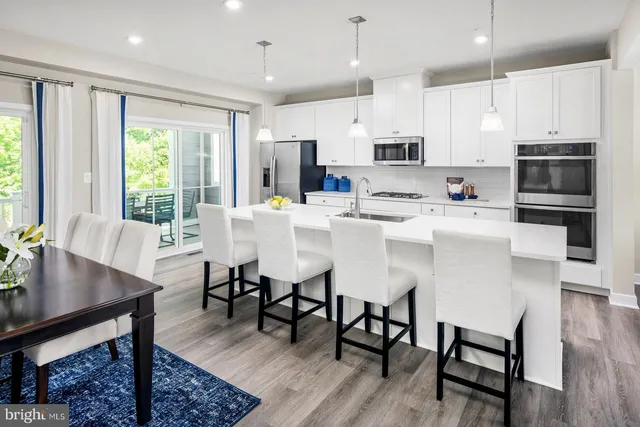 a view of kitchen with dining table and chairs