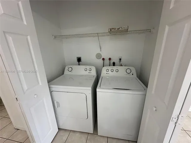 a white toilet sitting next to a sink