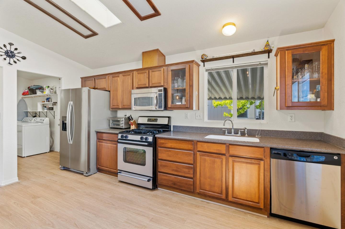 100 North Rodeo Gulch Road, Unit 31 Soquel, CA 95073 - Photo 12 of 38 a kitchen with stainless steel appliances granite countertop a refrigerator and a stove top oven