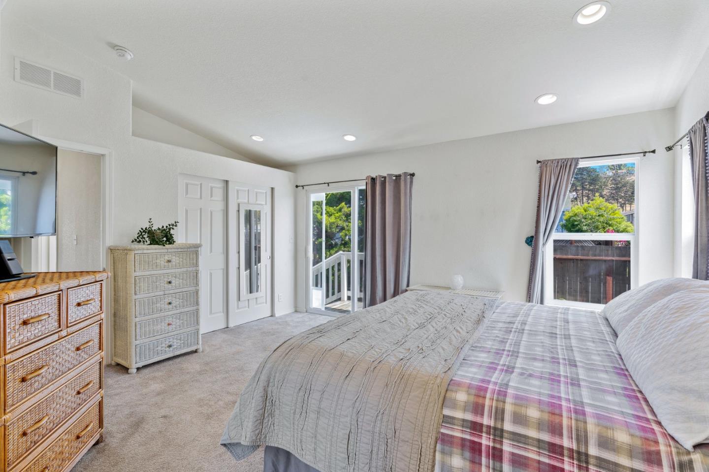 100 North Rodeo Gulch Road, Unit 31 Soquel, CA 95073 - Photo 20 of 38 a bedroom with a large bed and a dresser