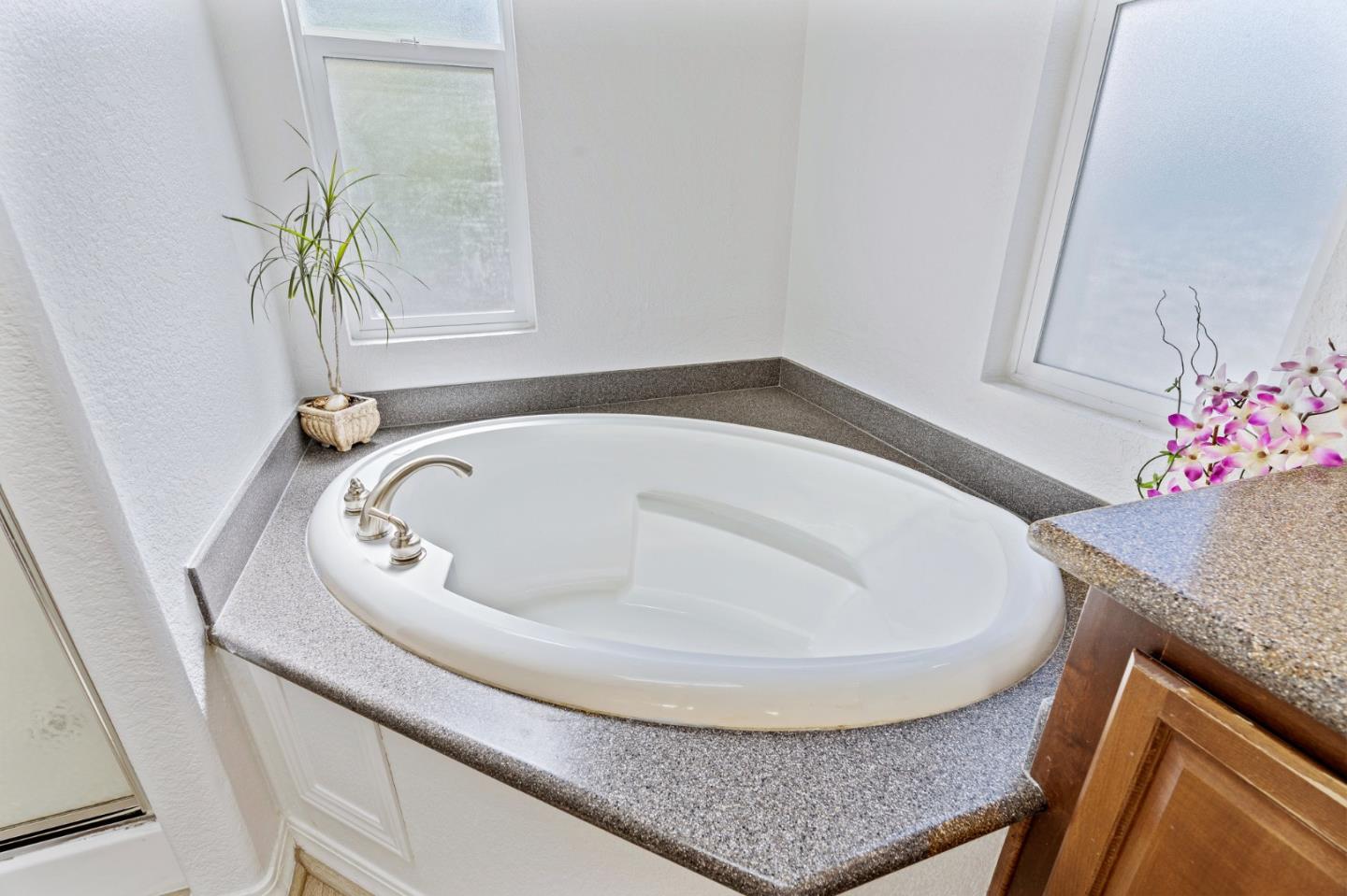 100 North Rodeo Gulch Road, Unit 31 Soquel, CA 95073 - Photo 22 of 38 a bathroom with a granite countertop sink and a mirror