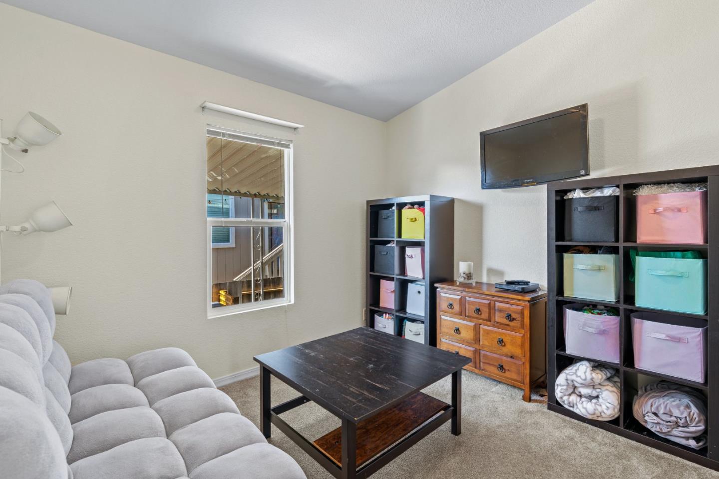 100 North Rodeo Gulch Road, Unit 31 Soquel, CA 95073 - Photo 25 of 38 a living room with furniture and a flat screen tv