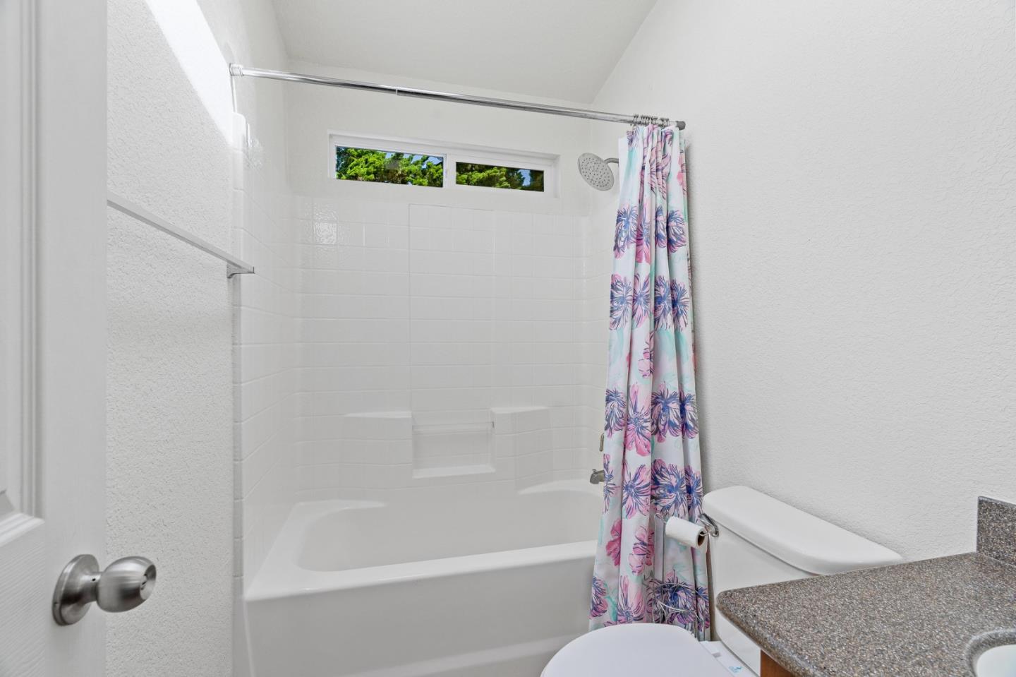 100 North Rodeo Gulch Road, Unit 31 Soquel, CA 95073 - Photo 27 of 38 a bathroom with a bathtub and shower