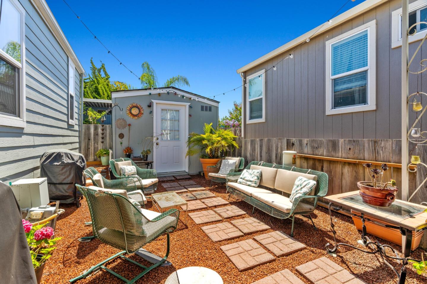 100 North Rodeo Gulch Road, Unit 31 Soquel, CA 95073 - Photo 29 of 38 a view of a patio with couches table and chairs and potted plants
