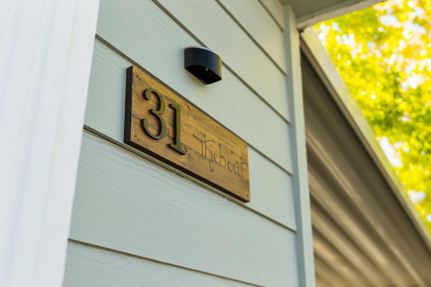 100 North Rodeo Gulch Road, Unit 31 Soquel, CA 95073 - Photo 4 of 38 a street sign on a window sill