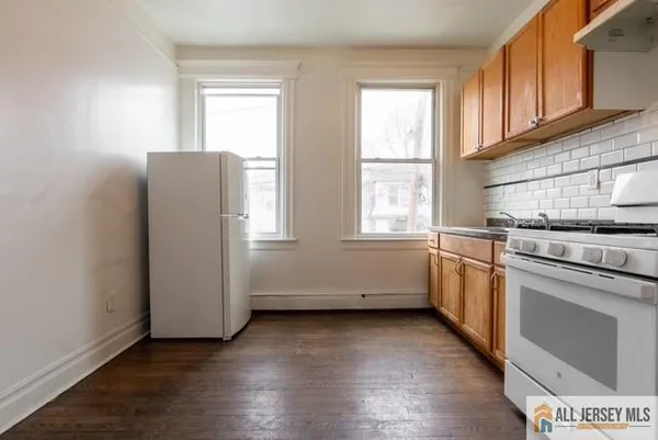 a kitchen with stainless steel appliances a refrigerator and a sink