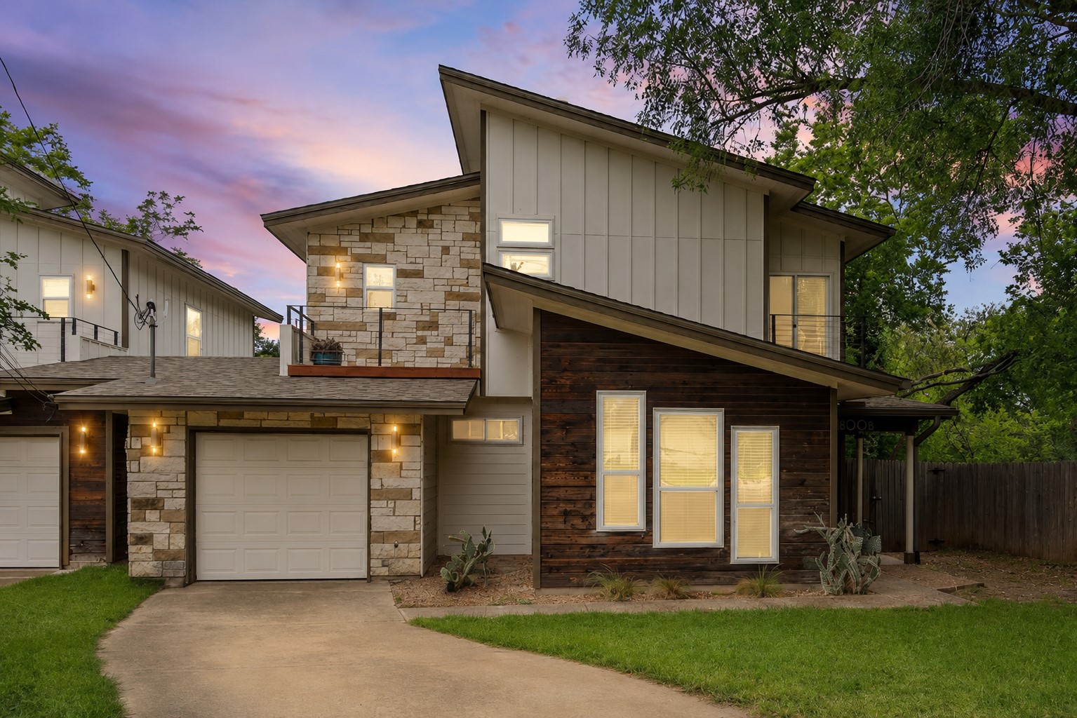 1800 Webberville Road, Unit B Austin, TX 78721 - Photo 3 of 30 Modern architectural facade featuring stone and wood-finish siding