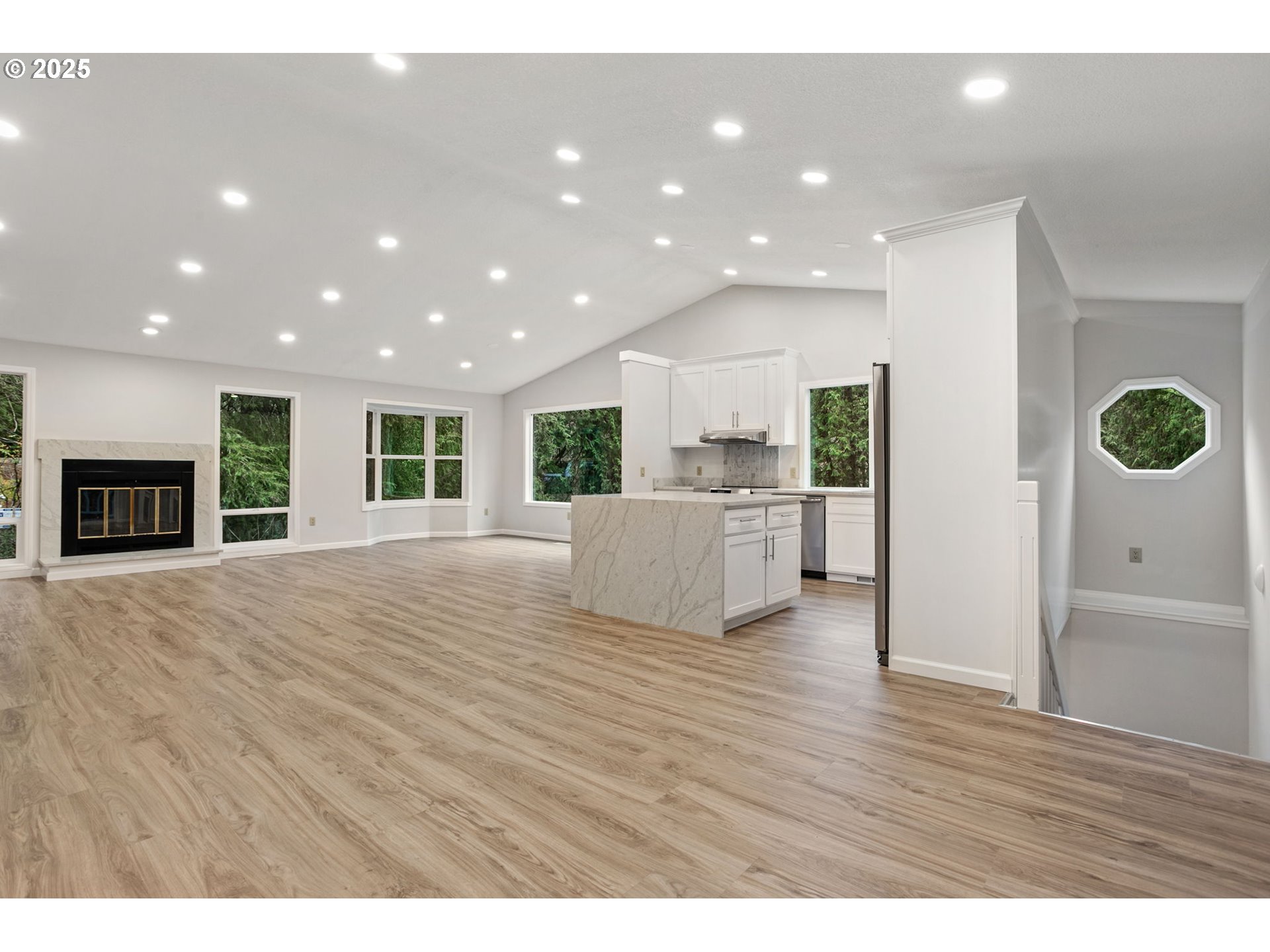 6647 Southeast 122nd Avenue Portland, OR 97266 - Photo 26 of 48 a view of an empty room with kitchen and window