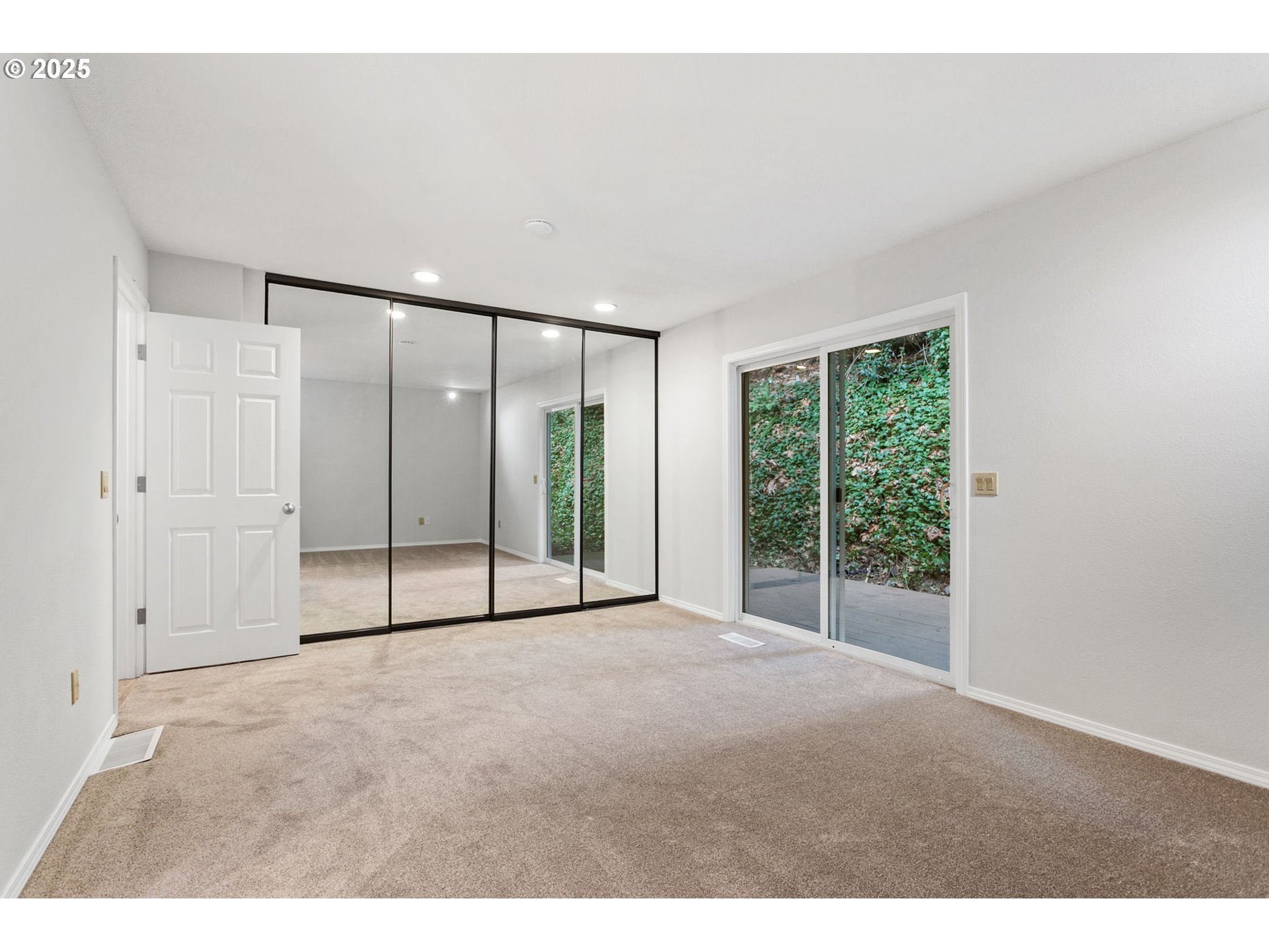 6647 Southeast 122nd Avenue Portland, OR 97266 - Photo 35 of 48 a view of an empty room with glass door