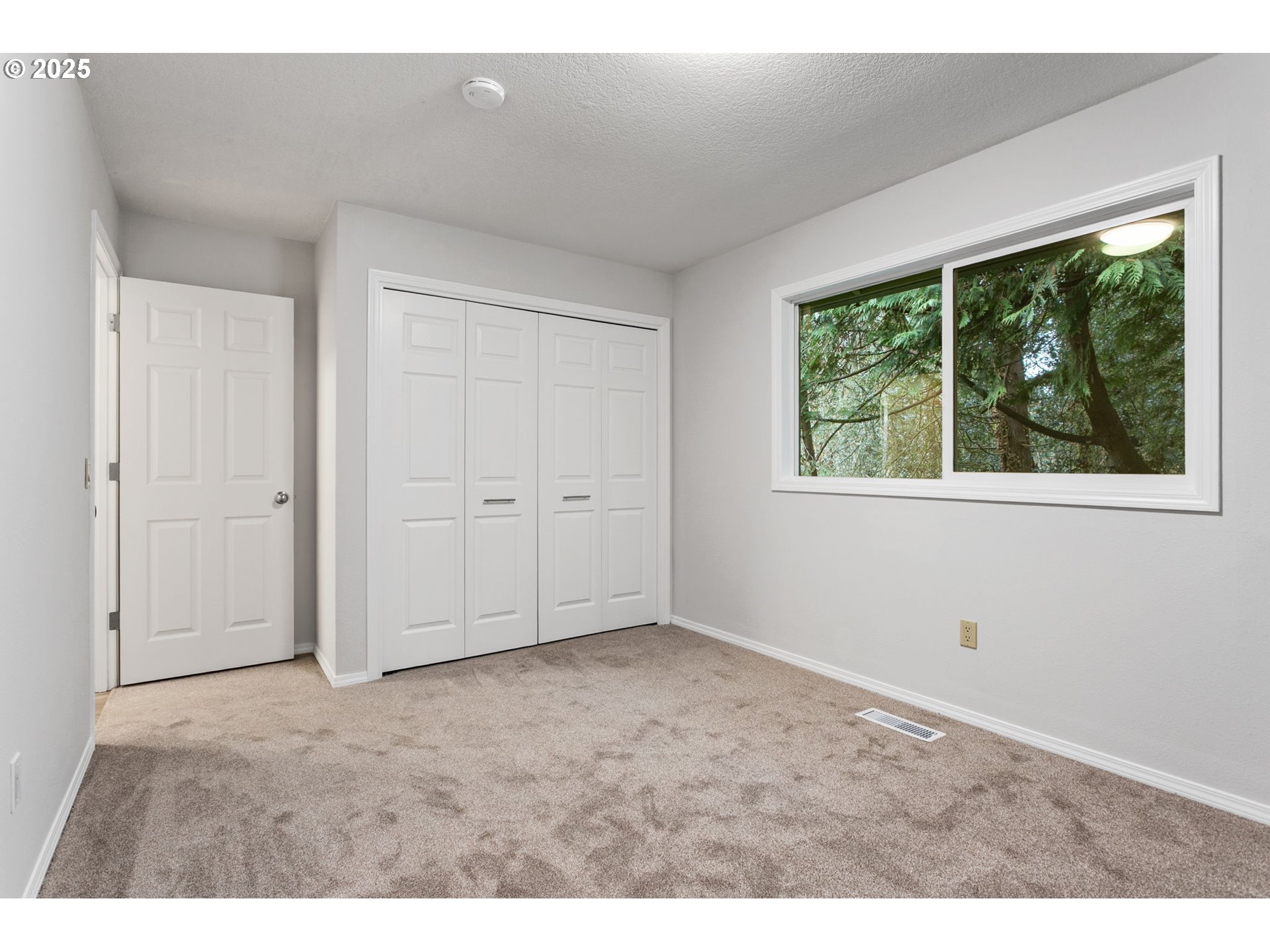 6647 Southeast 122nd Avenue Portland, OR 97266 - Photo 40 of 48 an empty room with windows
