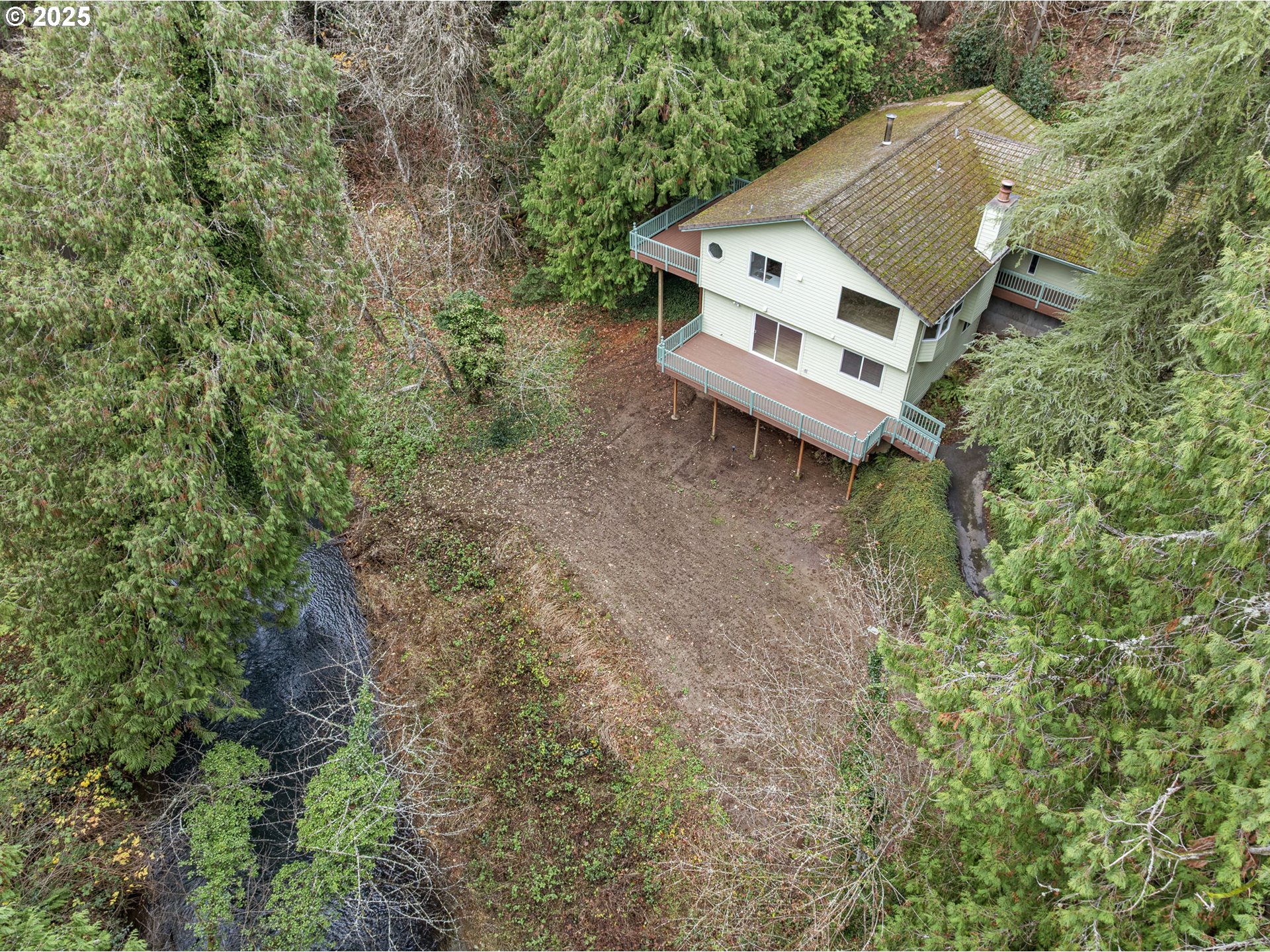 6647 Southeast 122nd Avenue Portland, OR 97266 - Photo 6 of 48 a view of a house with a yard and sitting area