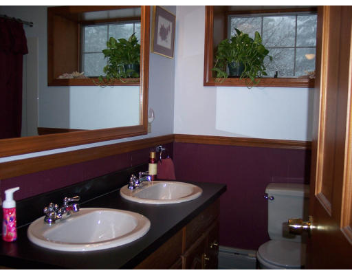 349 Green River Road Greenfield, MA 01301 - Photo 6 of 7 a bathroom with a sink and a mirror