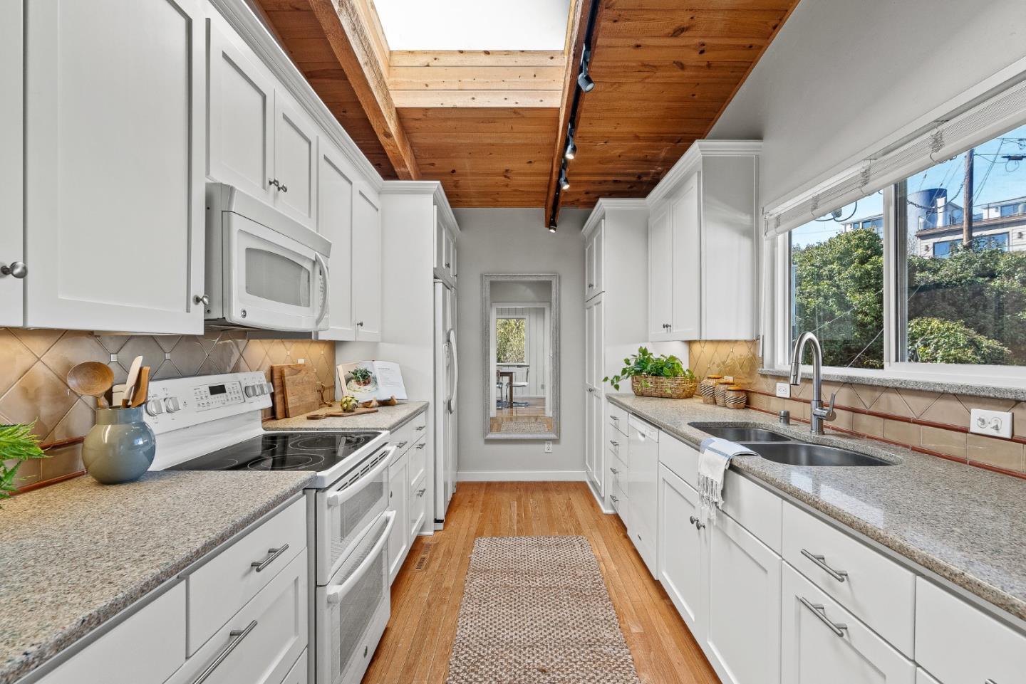 664 Bayview Drive Aptos, CA 95003 - Photo 18 of 46 a kitchen with stainless steel appliances granite countertop a sink a stove and cabinets