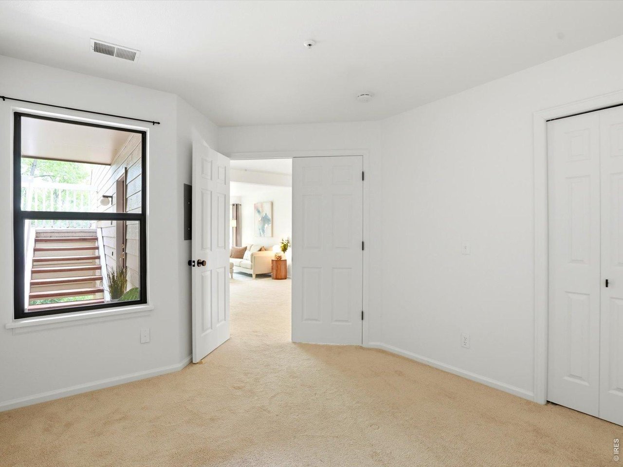 4945 Twin Lakes Road, Unit 46 Boulder, CO 80301 - Photo 31 of 42 The versatile secondary bedroom is perfect for guests, a home office, or your own workout space.