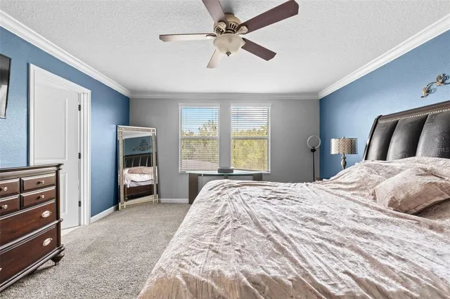 a bathroom with a tub shower and sink