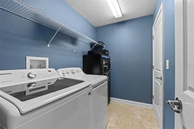 a living room with blue lights with furniture and a large window