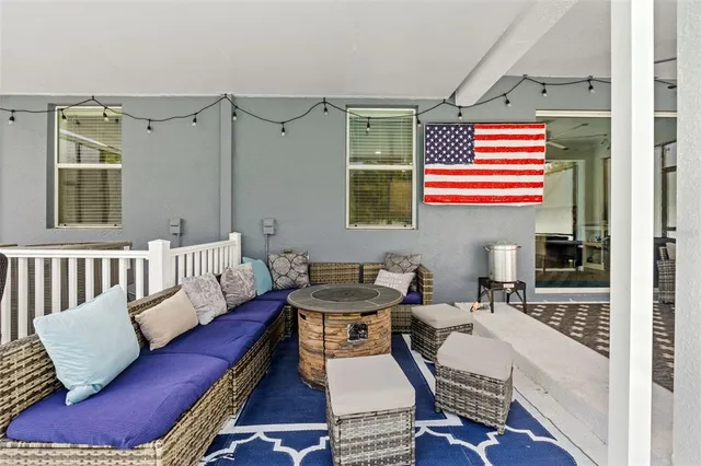 an aerial view of a house with a garden and swimming pool