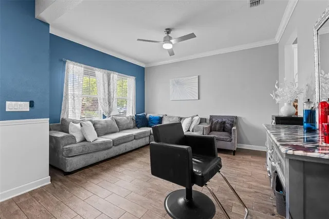 a living room with furniture and a window