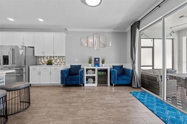 a kitchen with stainless steel appliances a stove a refrigerator a sink and dishwasher