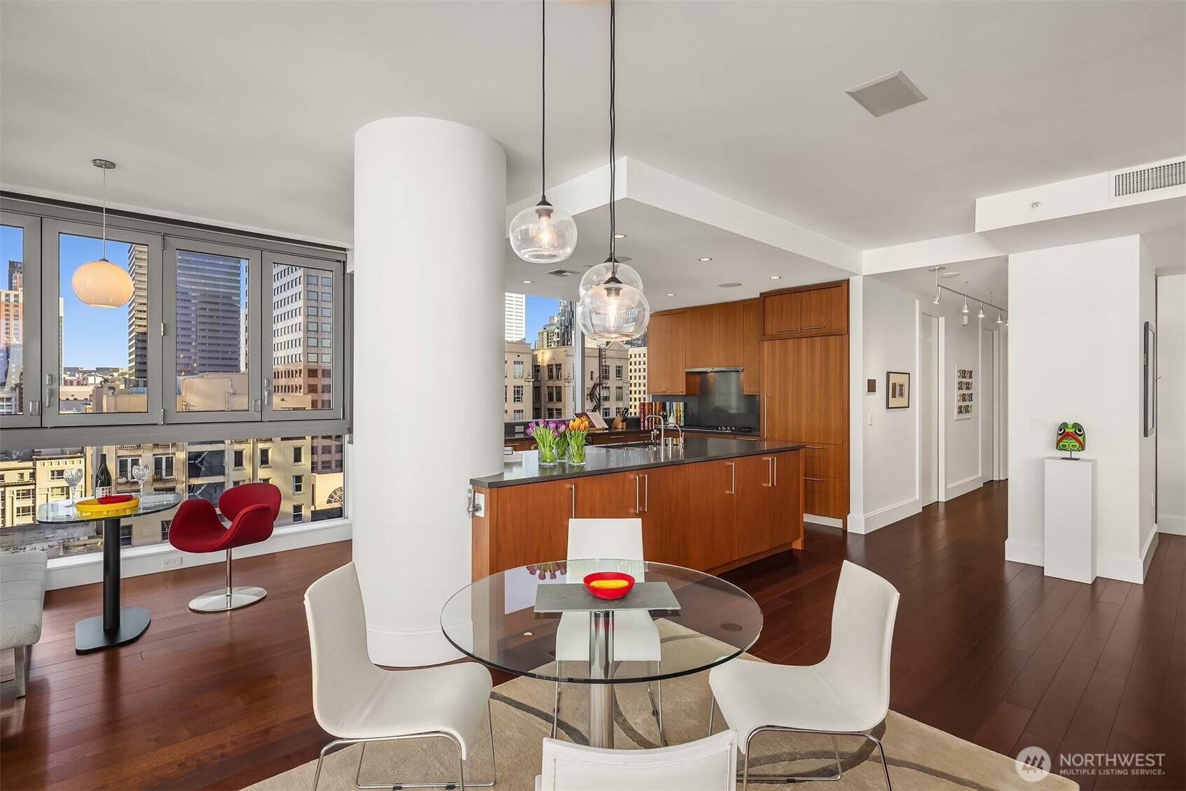 1521 2nd Avenue, Unit 1001 Seattle, WA 98101 - Photo 11 of 37 a living room with furniture and wooden floor