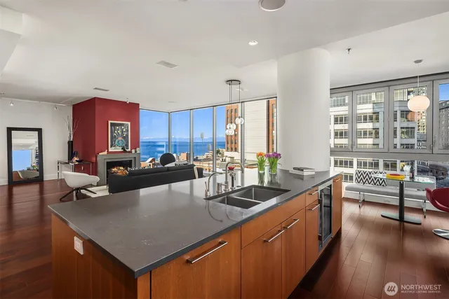 a kitchen with counter top space a sink cabinets and appliances