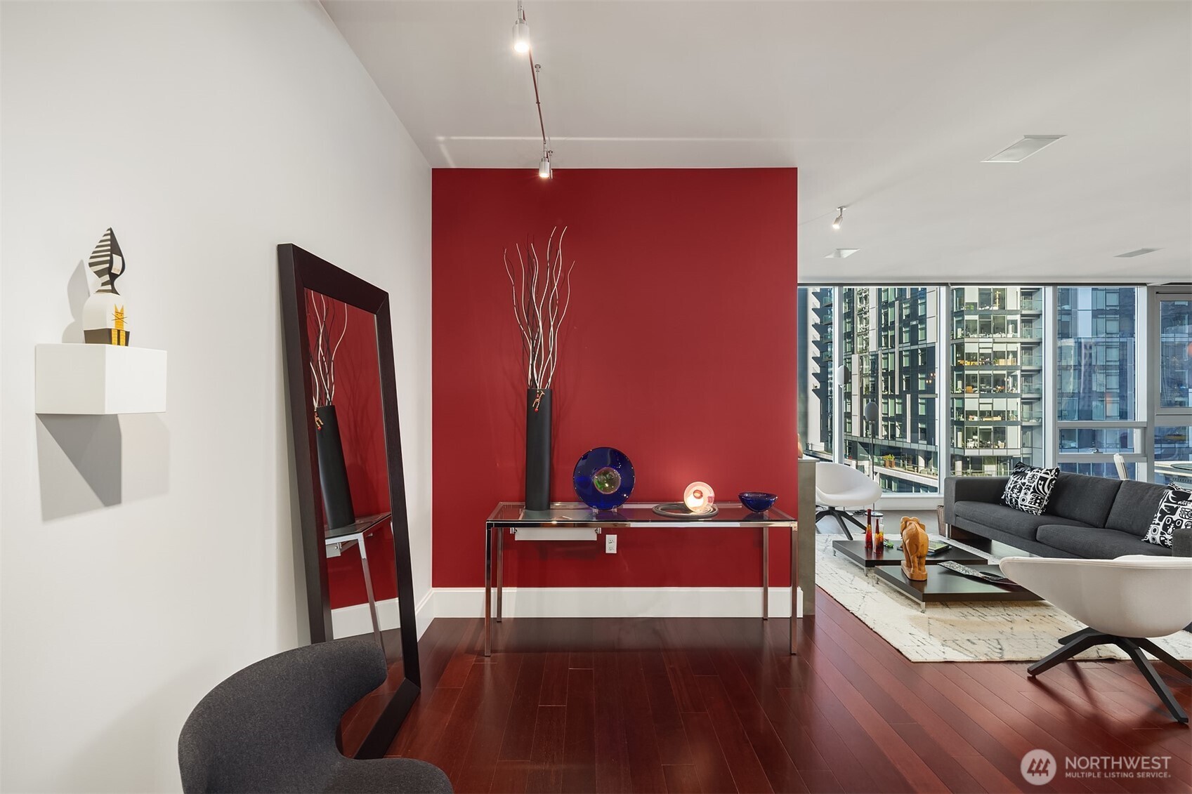 1521 2nd Avenue, Unit 1001 Seattle, WA 98101 - Photo 3 of 37 a living room with furniture and a large window
