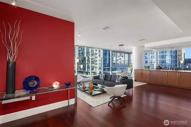 a living room with furniture and wooden floor
