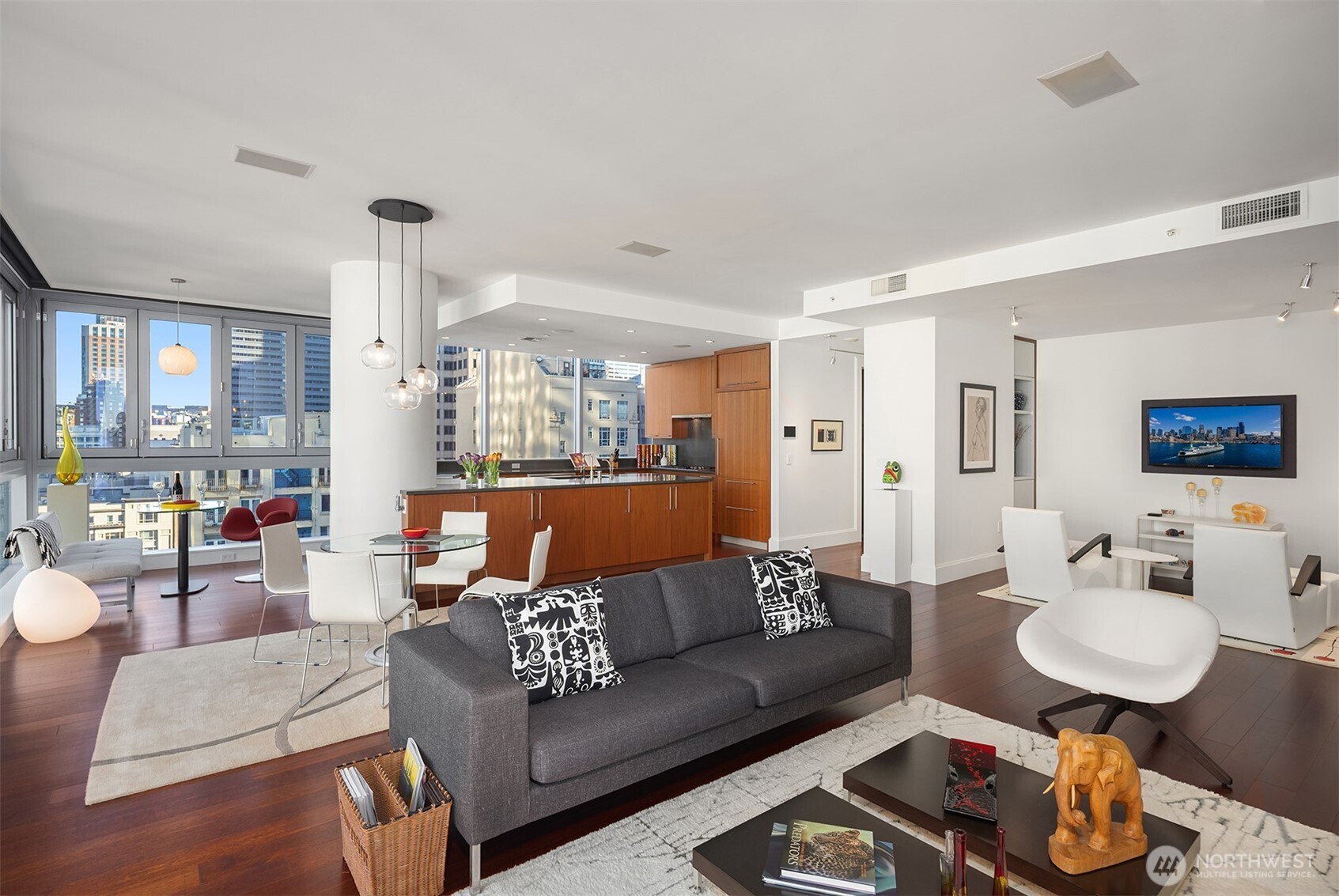 1521 2nd Avenue, Unit 1001 Seattle, WA 98101 - Photo 10 of 37 a living room with furniture and a table